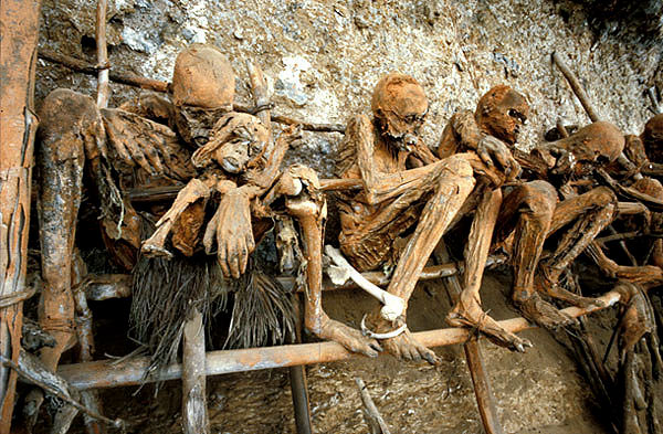Corpse preserved with red soil in burial caves on cliffs near Oiwa Village, Papua New Guinea.